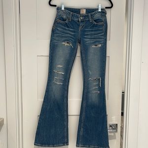 Flare low rise ripped jeans